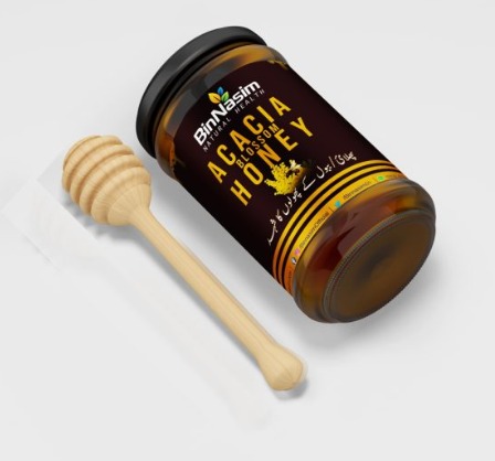 Bin Nasim product acacia honey jar with spoon lying on the table